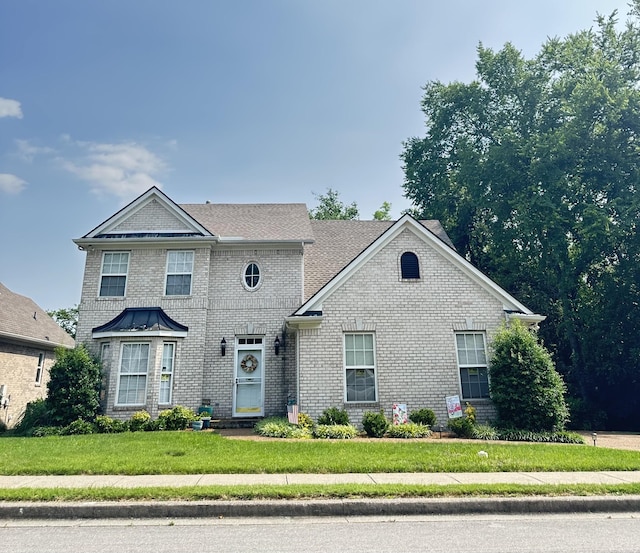 6644 Christiansted Ln, Nashville, TN 37211 - view of front of house featuring brick siding and a front lawn