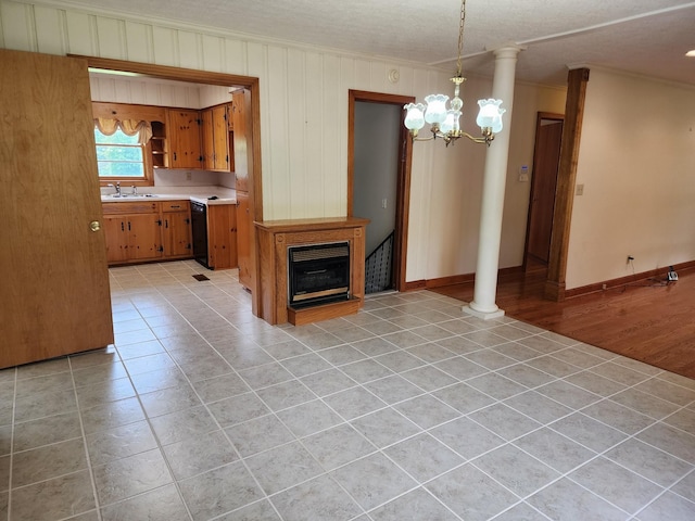 1036 Old Bottom Rd, Lafayette, TN 37083 - unfurnished living room with crown molding, light tile patterned floors, a chandelier, and a glass covered fireplace