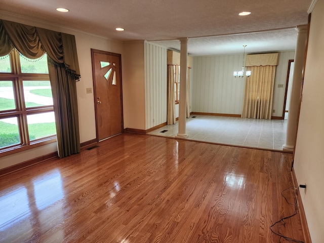 1036 Old Bottom Rd, Lafayette, TN 37083 - foyer with ornate columns, wood finished floors, a chandelier, a textured ceiling, and recessed lighting