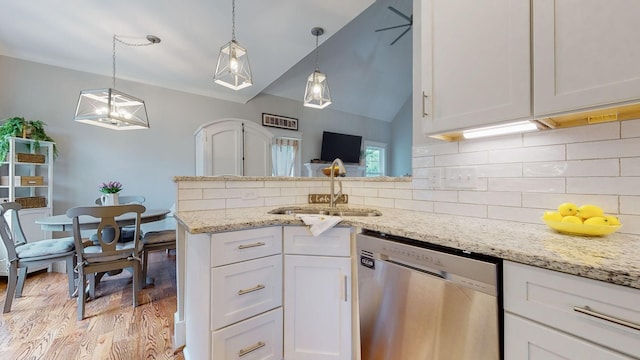 7146 Pepper Tree Cir, Fairview, TN 37062 - kitchen with dishwasher, white cabinets, light wood-style floors, light stone counters, and vaulted ceiling