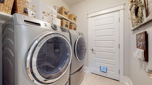 7146 Pepper Tree Cir, Fairview, TN 37062 - laundry room featuring light tile patterned floors and washing machine and dryer