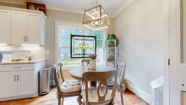 7146 Pepper Tree Cir, Fairview, TN 37062 - dining room featuring healthy amount of natural light, light wood finished floors, and a chandelier