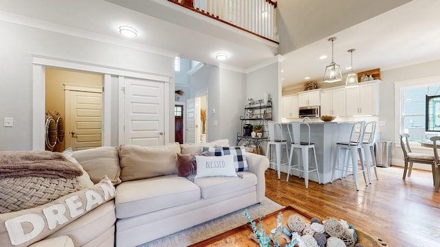 7146 Pepper Tree Cir, Fairview, TN 37062 - living room featuring crown molding, light wood-style floors, and recessed lighting