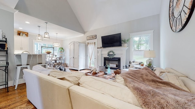 7146 Pepper Tree Cir, Fairview, TN 37062 - living area with a fireplace, light wood-style floors, vaulted ceiling, and recessed lighting
