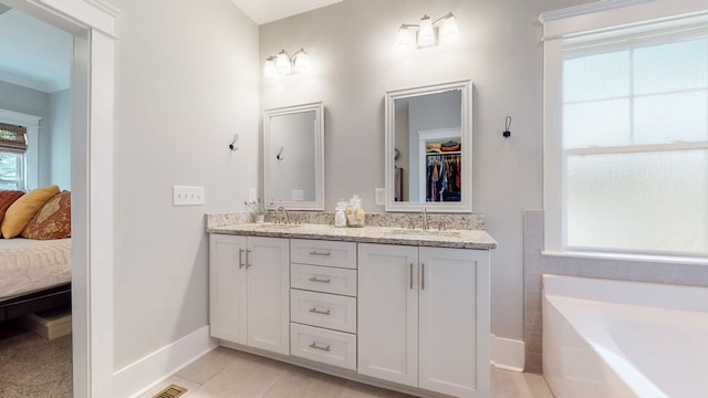 7146 Pepper Tree Cir, Fairview, TN 37062 - full bath with double vanity, a garden tub, ensuite bathroom, and tile patterned floors
