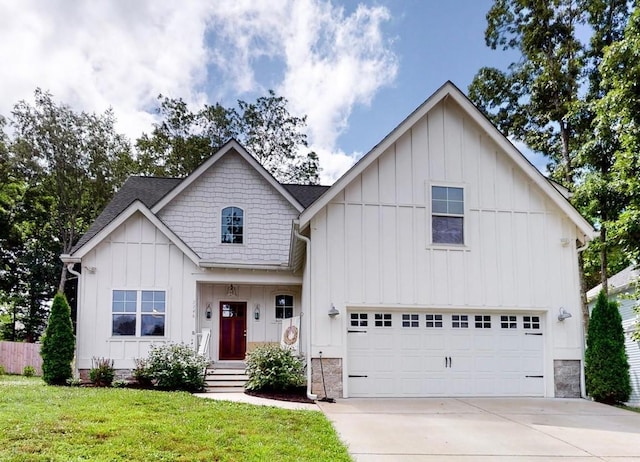 7146 Pepper Tree Cir, Fairview, TN 37062 - view of front of home with board and batten siding, concrete driveway, a front lawn, an attached garage, and a shingled roof