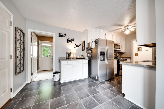 536 Deer Path, Gallatin, TN 37066 - kitchen with stainless steel appliances, white cabinets, a ceiling fan, and a textured ceiling