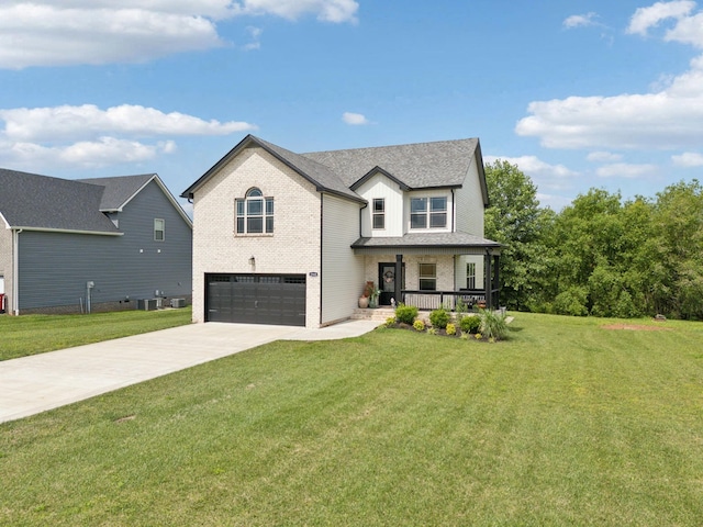 2968 Kirkwood Rd, Clarksville, TN 37043 - view of front facade with a porch, brick siding, a garage, concrete driveway, and a front lawn