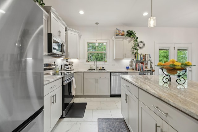 2968 Kirkwood Rd, Clarksville, TN 37043 - kitchen with stainless steel appliances, light marble finish floors, plenty of natural light, decorative backsplash, and recessed lighting