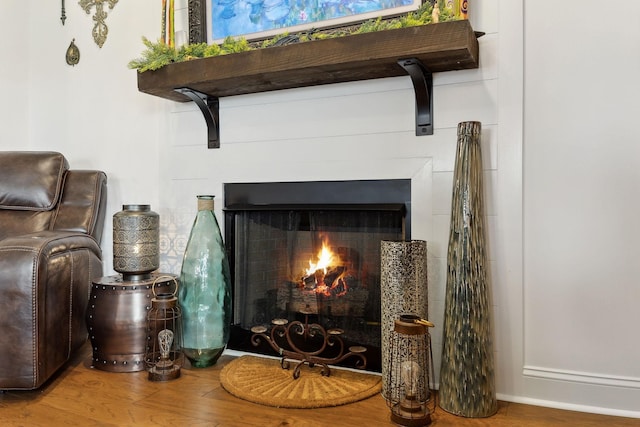 2968 Kirkwood Rd, Clarksville, TN 37043 - detailed view of wood finished floors and a warm lit fireplace