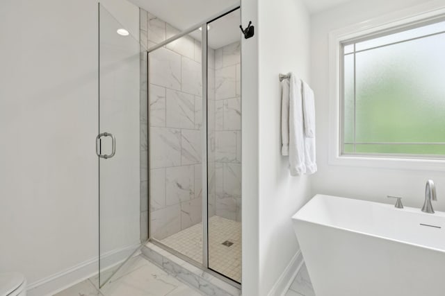 2968 Kirkwood Rd, Clarksville, TN 37043 - bathroom with marble look tiles, a freestanding bath, and a marble finish shower