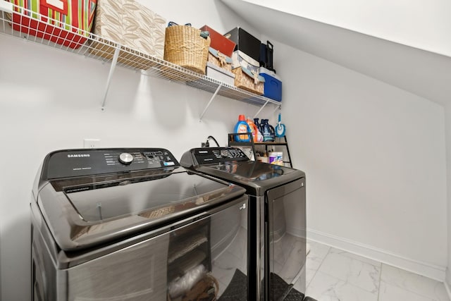 2968 Kirkwood Rd, Clarksville, TN 37043 - laundry area featuring separate washer and dryer and light marble finish flooring