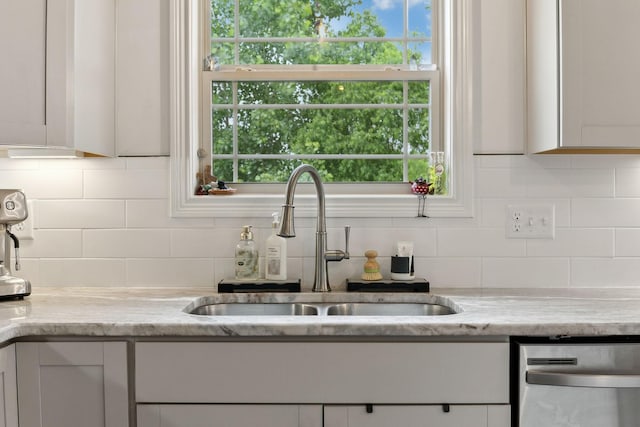 2968 Kirkwood Rd, Clarksville, TN 37043 - kitchen featuring dishwasher, decorative backsplash, plenty of natural light, and light stone countertops