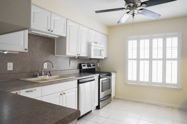 4861 Quail Run, Old Hickory, TN 37138 - kitchen with appliances with stainless steel finishes, healthy amount of natural light, tasteful backsplash, white cabinets, and a textured ceiling