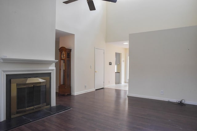 4861 Quail Run, Old Hickory, TN 37138 - unfurnished living room featuring ceiling fan, wood finished floors, a high ceiling, and a glass covered fireplace