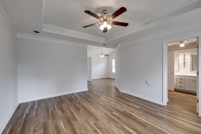 3216 Vestry Ave, Murfreesboro, TN 37129 - empty room featuring a raised ceiling, ceiling fan, wood finished floors, and crown molding