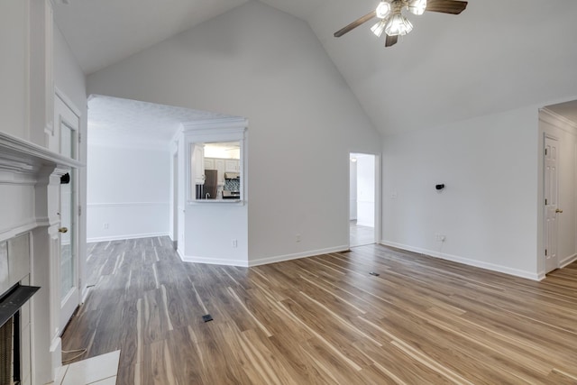 3216 Vestry Ave, Murfreesboro, TN 37129 - unfurnished living room with ceiling fan, high vaulted ceiling, a fireplace, and light wood-style flooring