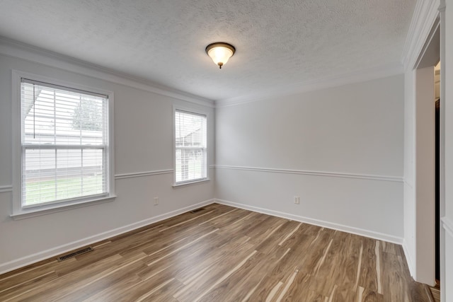 3216 Vestry Ave, Murfreesboro, TN 37129 - empty room with ornamental molding, wood finished floors, healthy amount of natural light, and a textured ceiling