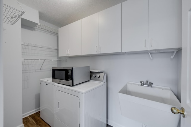 3216 Vestry Ave, Murfreesboro, TN 37129 - laundry room featuring independent washer and dryer, cabinet space, dark wood-style floors, and a textured ceiling