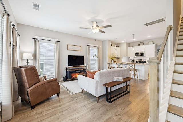 2515 Napa Valley Way, Columbia, TN 38401 - living room with stairway, a ceiling fan, light wood finished floors, healthy amount of natural light, and recessed lighting