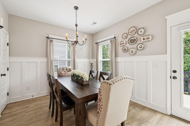 2515 Napa Valley Way, Columbia, TN 38401 - dining space featuring a chandelier, a decorative wall, wainscoting, light wood-style flooring, and plenty of natural light