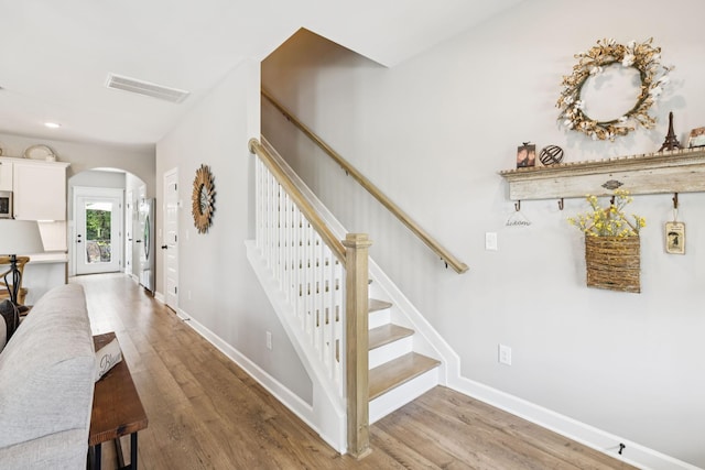2515 Napa Valley Way, Columbia, TN 38401 - stairway with arched walkways and wood finished floors