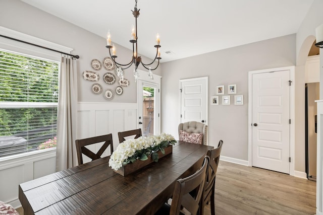 2515 Napa Valley Way, Columbia, TN 38401 - dining area featuring a chandelier, light wood finished floors, and arched walkways