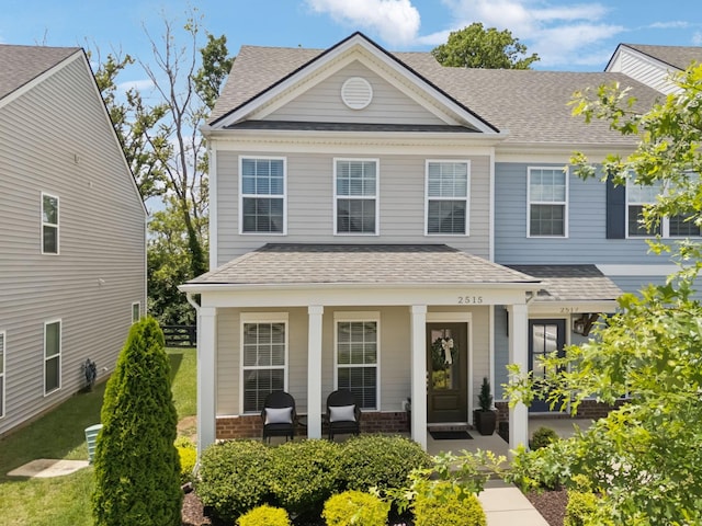 2515 Napa Valley Way, Columbia, TN 38401 - view of front facade with covered porch, a shingled roof, a front lawn, and brick siding