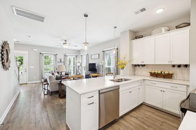 2515 Napa Valley Way, Columbia, TN 38401 - kitchen with dishwasher, a peninsula, open floor plan, backsplash, and electric stove