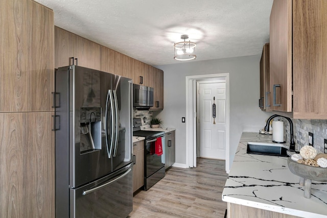 7646 S Swift Rd, Goodlettsville, TN 37072 - kitchen featuring stainless steel fridge with ice dispenser, electric range, decorative backsplash, light wood finished floors, and a textured ceiling