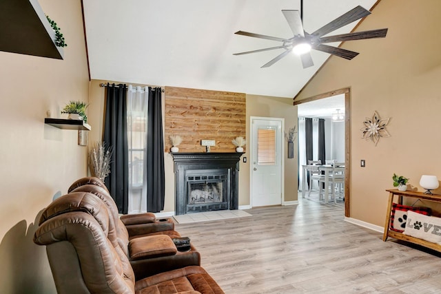 7646 S Swift Rd, Goodlettsville, TN 37072 - living room featuring ceiling fan, high vaulted ceiling, light wood-type flooring, and a fireplace with flush hearth
