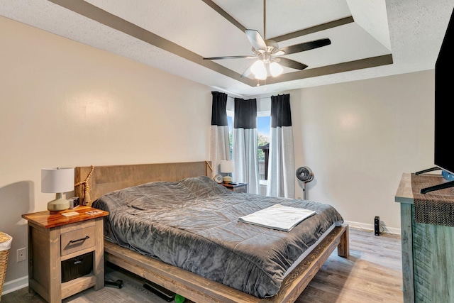 7646 S Swift Rd, Goodlettsville, TN 37072 - bedroom with a tray ceiling, light wood finished floors, and a ceiling fan