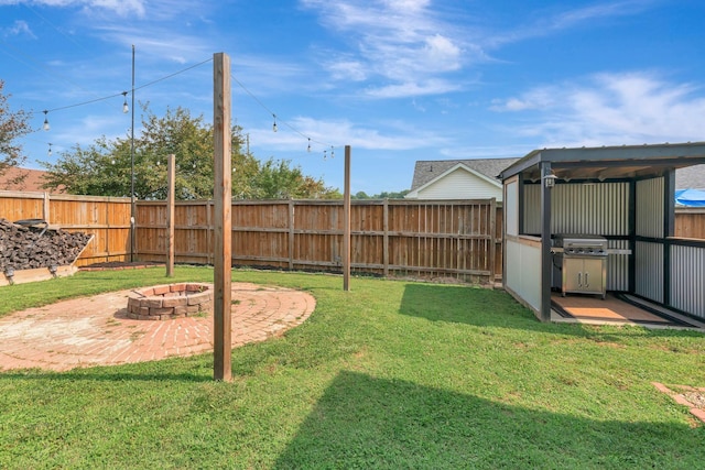 7646 S Swift Rd, Goodlettsville, TN 37072 - fenced backyard featuring an outdoor fire pit and a patio area