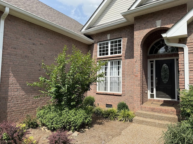 740 N Palmers Chapel Rd, White House, TN 37188 - doorway to property with brick siding, crawl space, and a shingled roof