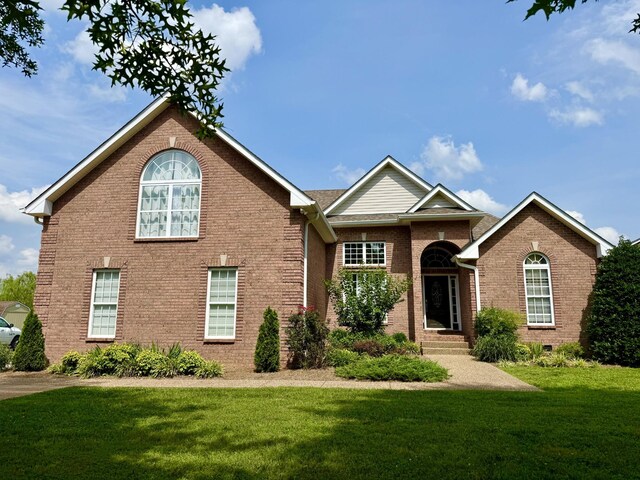 740 N Palmers Chapel Rd, White House, TN 37188 - view of front facade featuring a front yard and brick siding