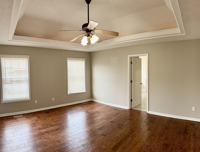 740 N Palmers Chapel Rd, White House, TN 37188 - empty room with a tray ceiling, a ceiling fan, and wood finished floors