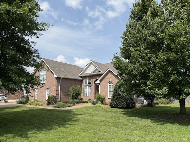 740 N Palmers Chapel Rd, White House, TN 37188 - traditional-style house with brick siding and a front yard