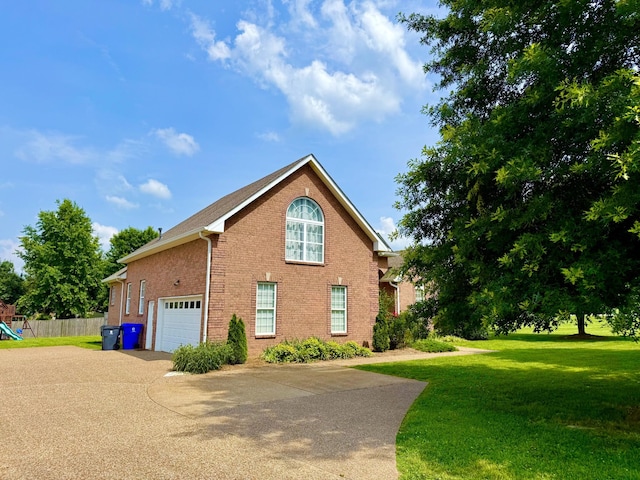 740 N Palmers Chapel Rd, White House, TN 37188 - view of home's exterior with brick siding, driveway, and a garage