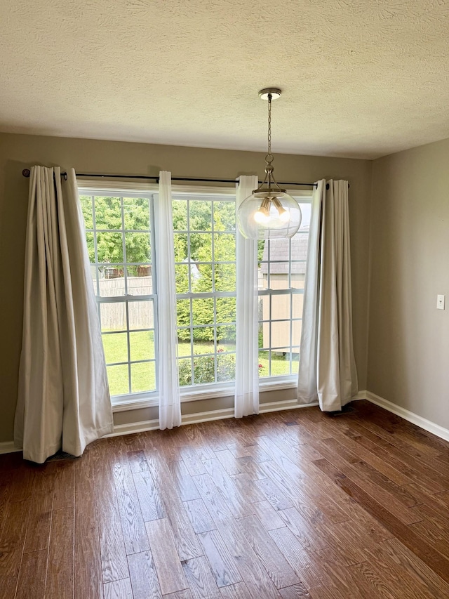 740 N Palmers Chapel Rd, White House, TN 37188 - unfurnished dining area featuring wood finished floors and a textured ceiling