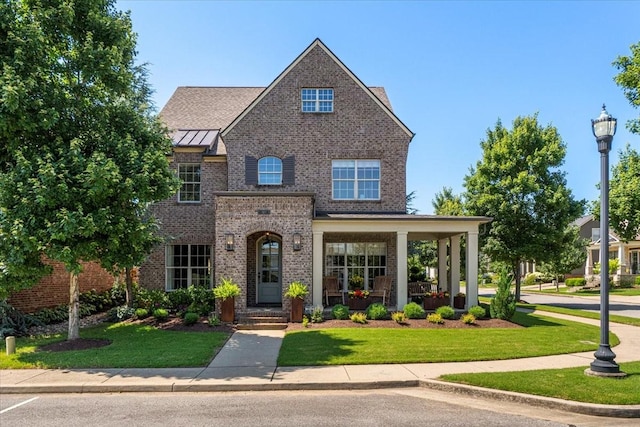 600 Tywater Crossing Blvd, Franklin, TN 37064 - view of front of property featuring a front lawn, brick siding, and a standing seam roof