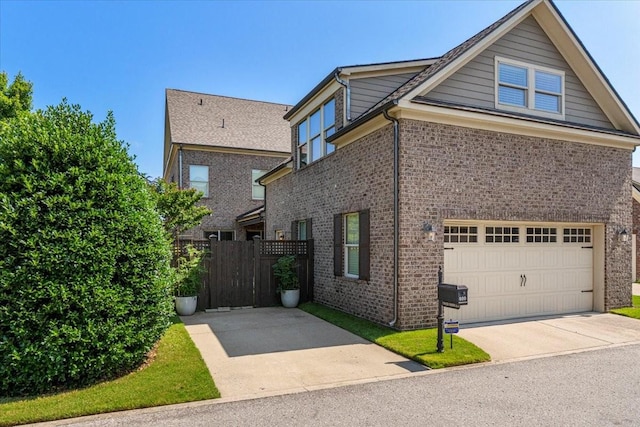 600 Tywater Crossing Blvd, Franklin, TN 37064 - view of side of home with a garage, brick siding, and driveway