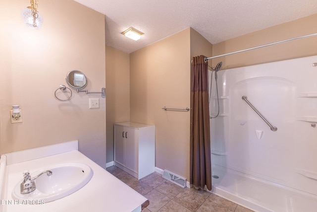 100 Cusick Cir, Lenoir City, TN 37772 - full bath featuring curtained shower, vanity, a textured ceiling, and tile patterned flooring