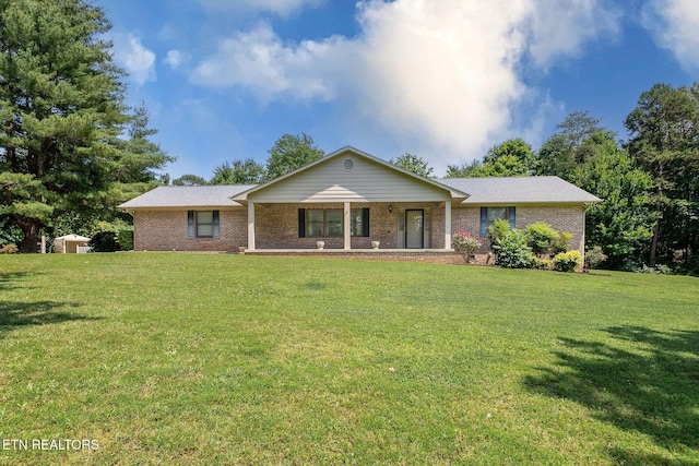 100 Cusick Cir, Lenoir City, TN 37772 - ranch-style home with brick siding, a front lawn, and covered porch