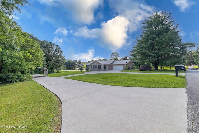 100 Cusick Cir, Lenoir City, TN 37772 - view of front facade featuring a front yard and concrete driveway