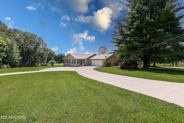 100 Cusick Cir, Lenoir City, TN 37772 - ranch-style home with a front yard, driveway, an attached garage, and stone siding