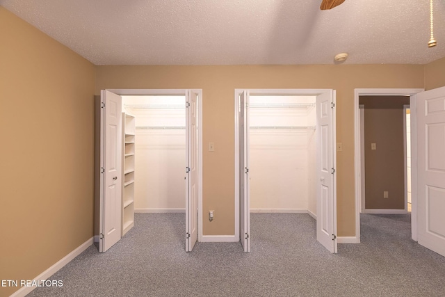 100 Cusick Cir, Lenoir City, TN 37772 - unfurnished bedroom featuring a spacious closet, carpet flooring, a closet, and a textured ceiling