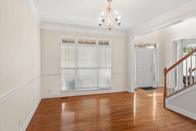1164 Sydney Ter, Mount Juliet, TN 37122 - entrance foyer featuring a chandelier, crown molding, stairway, wood finished floors, and ornate columns