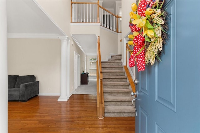 1164 Sydney Ter, Mount Juliet, TN 37122 - entryway with ornamental molding, decorative columns, stairway, wood finished floors, and a towering ceiling