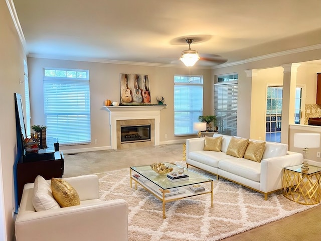 1164 Sydney Ter, Mount Juliet, TN 37122 - carpeted living area with crown molding, a ceiling fan, a fireplace with flush hearth, and ornate columns