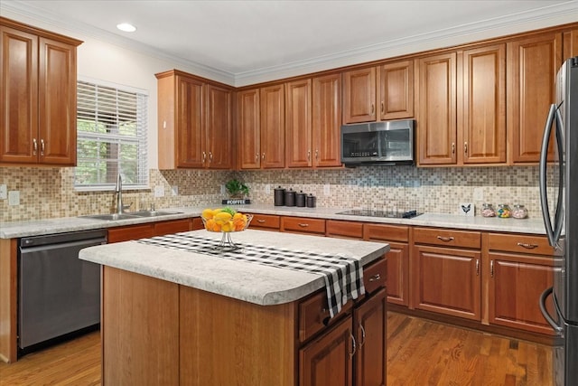 1164 Sydney Ter, Mount Juliet, TN 37122 - kitchen with appliances with stainless steel finishes, crown molding, light countertops, wood finished floors, and recessed lighting